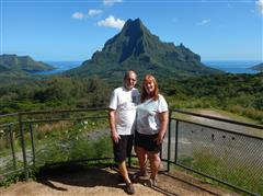 Pat and Dennis with the mountains in Tahiti
